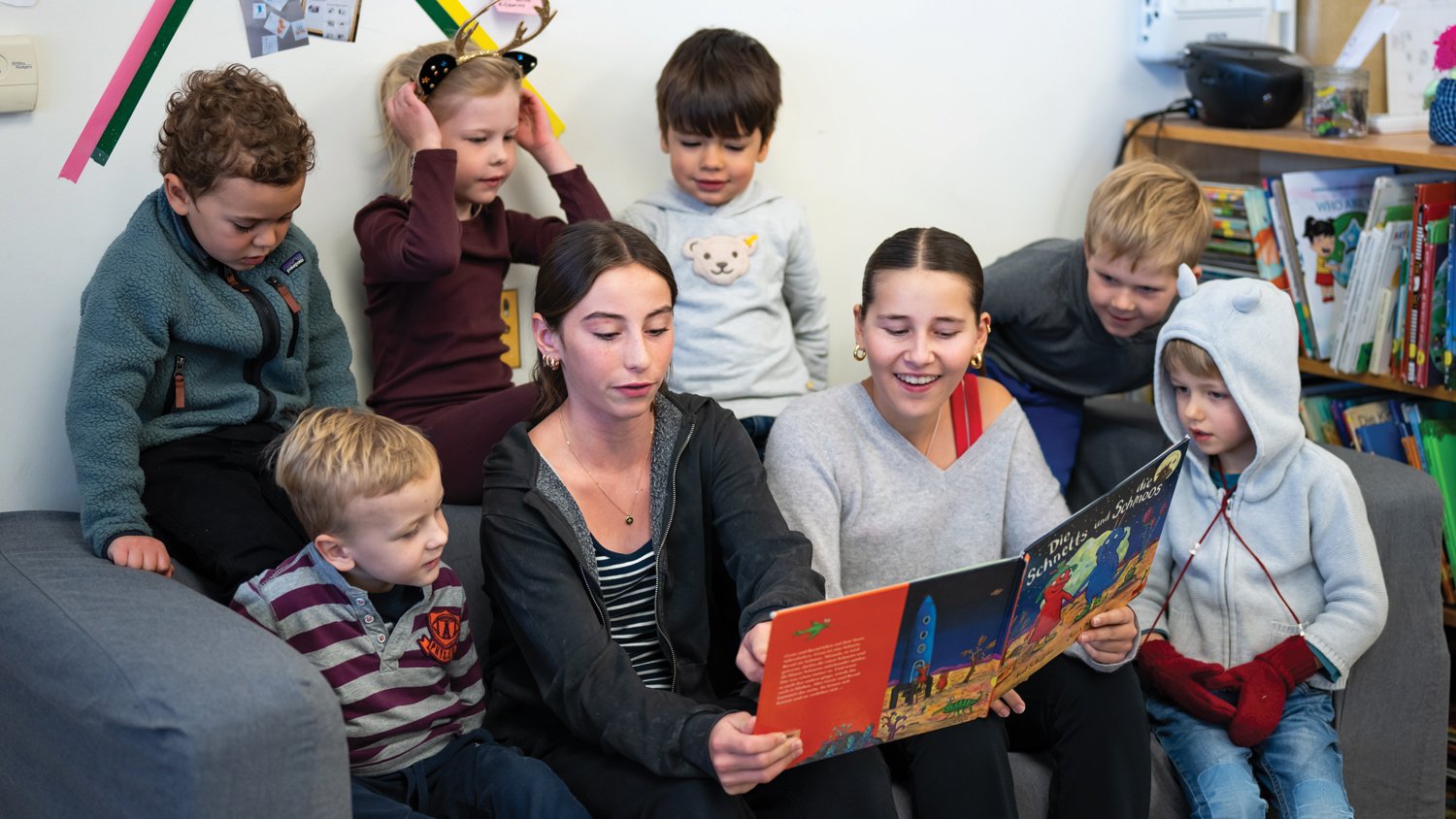 German middle schoolers read to early years students