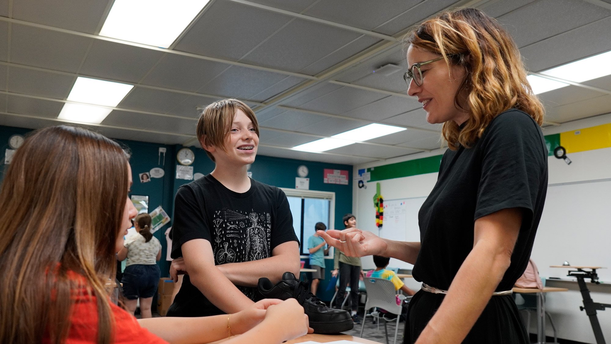 Students and teacher preparing for the play