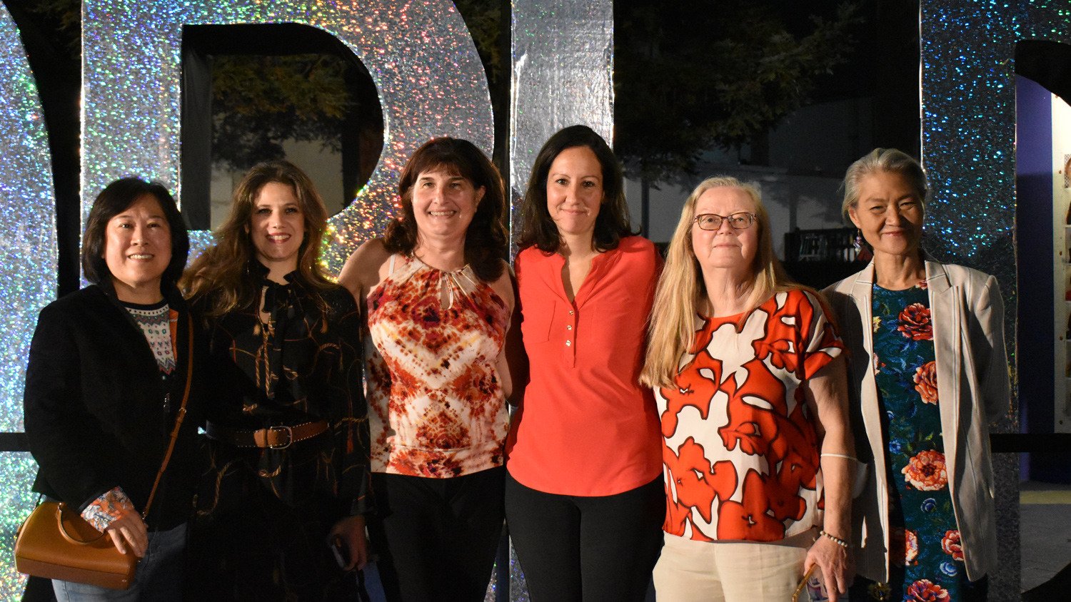 Art Teachers posed together outside of the entrance