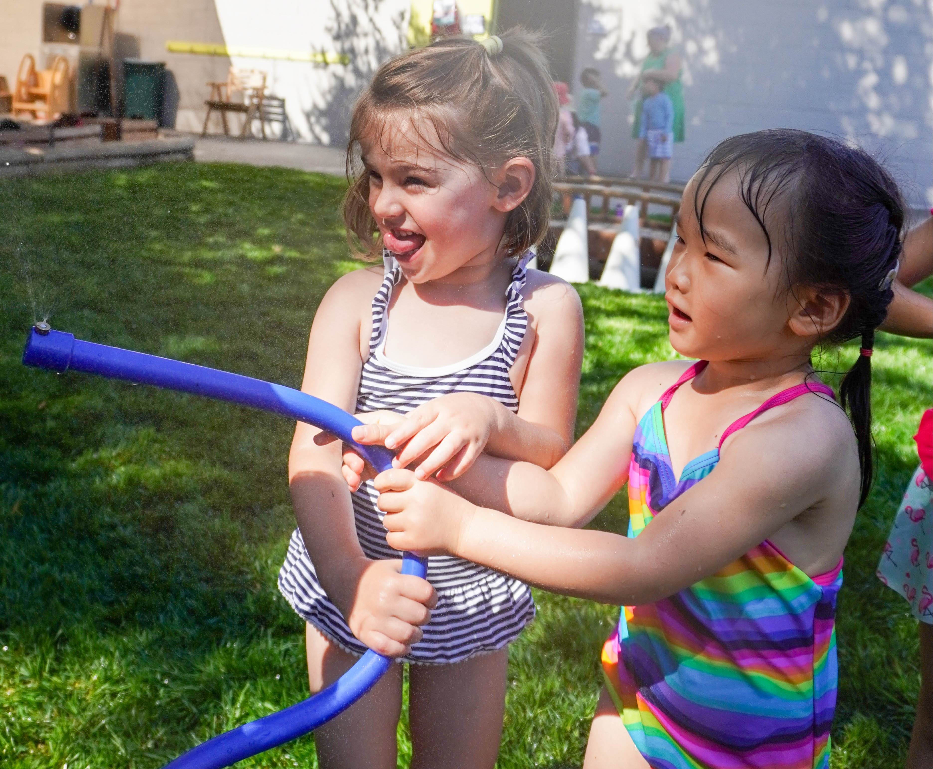Sharing the sprinkler is part of children's social development