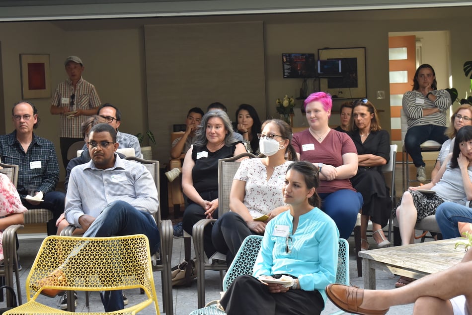 INTL Parents in an audience listening to speakers