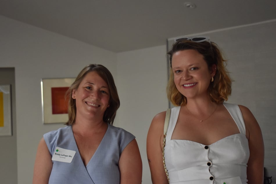 Two women standing side by side