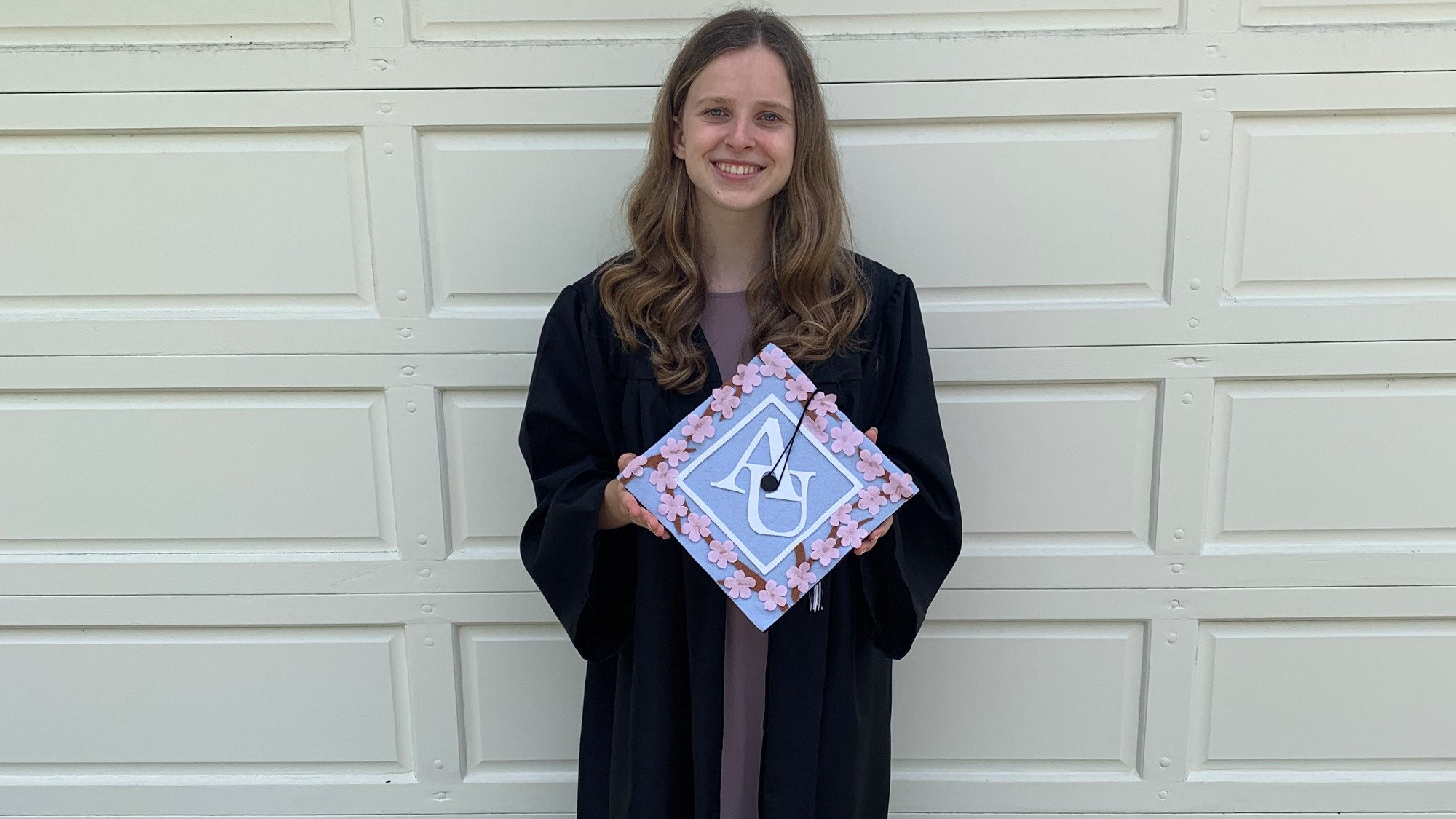 Dana-with-her-grad-cap-from-AU