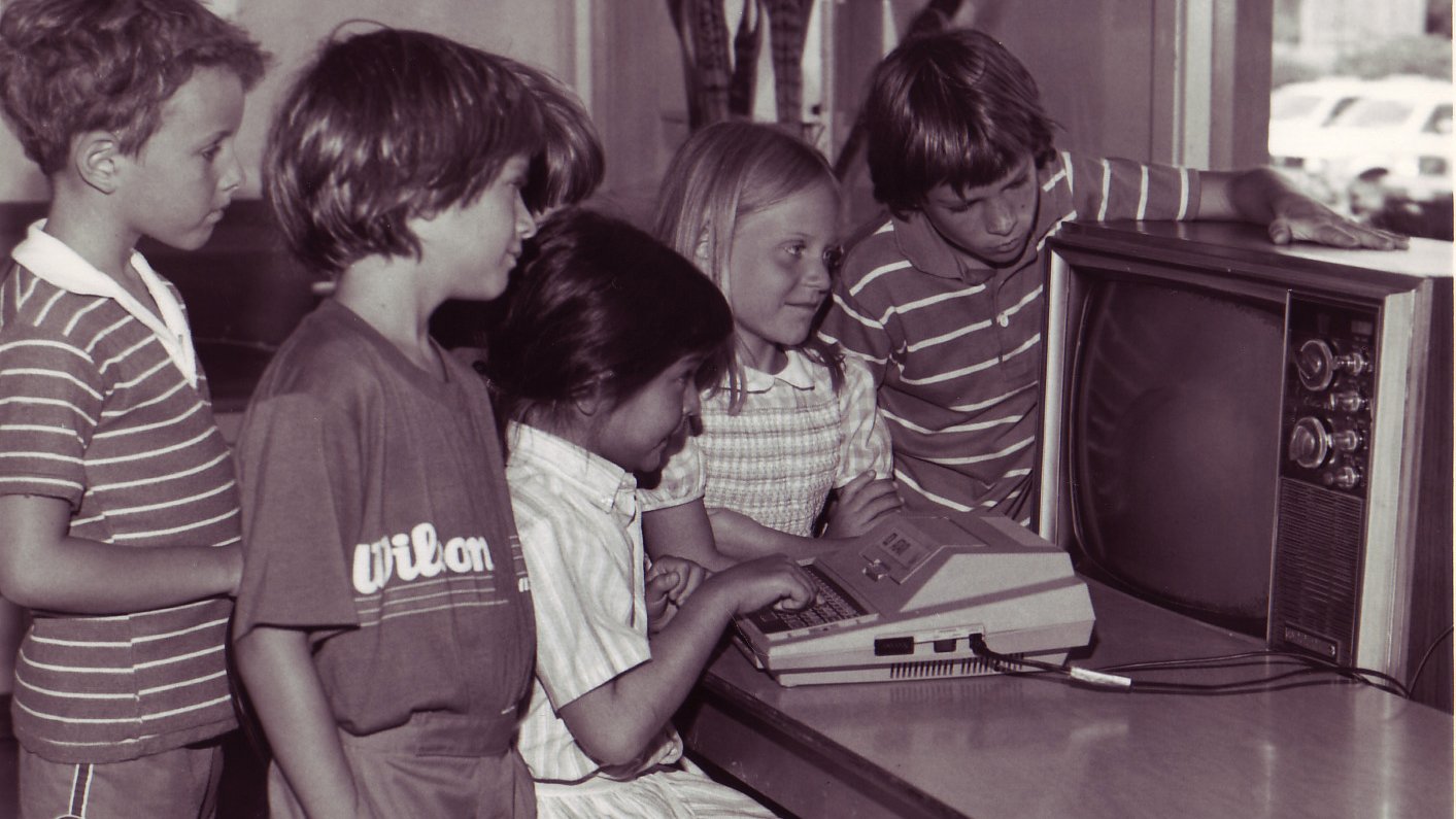 Students using the first computers at the school