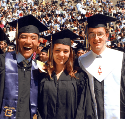 Mandy's HS Graduation with two friends posing for a photo in cap and gown
