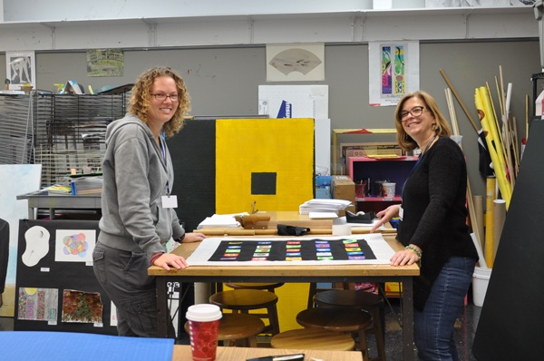 2013 Arts Night CHair, Kristin Lèfevre (left), assisted by parent volunteer and Trustee, Terri Kalia.