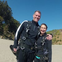 Kate Biller and husband posing after parasailing
