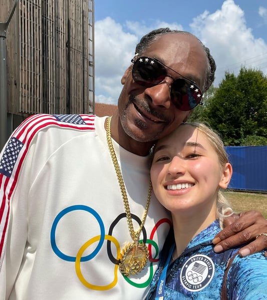 Maia taking a photo with Snoop