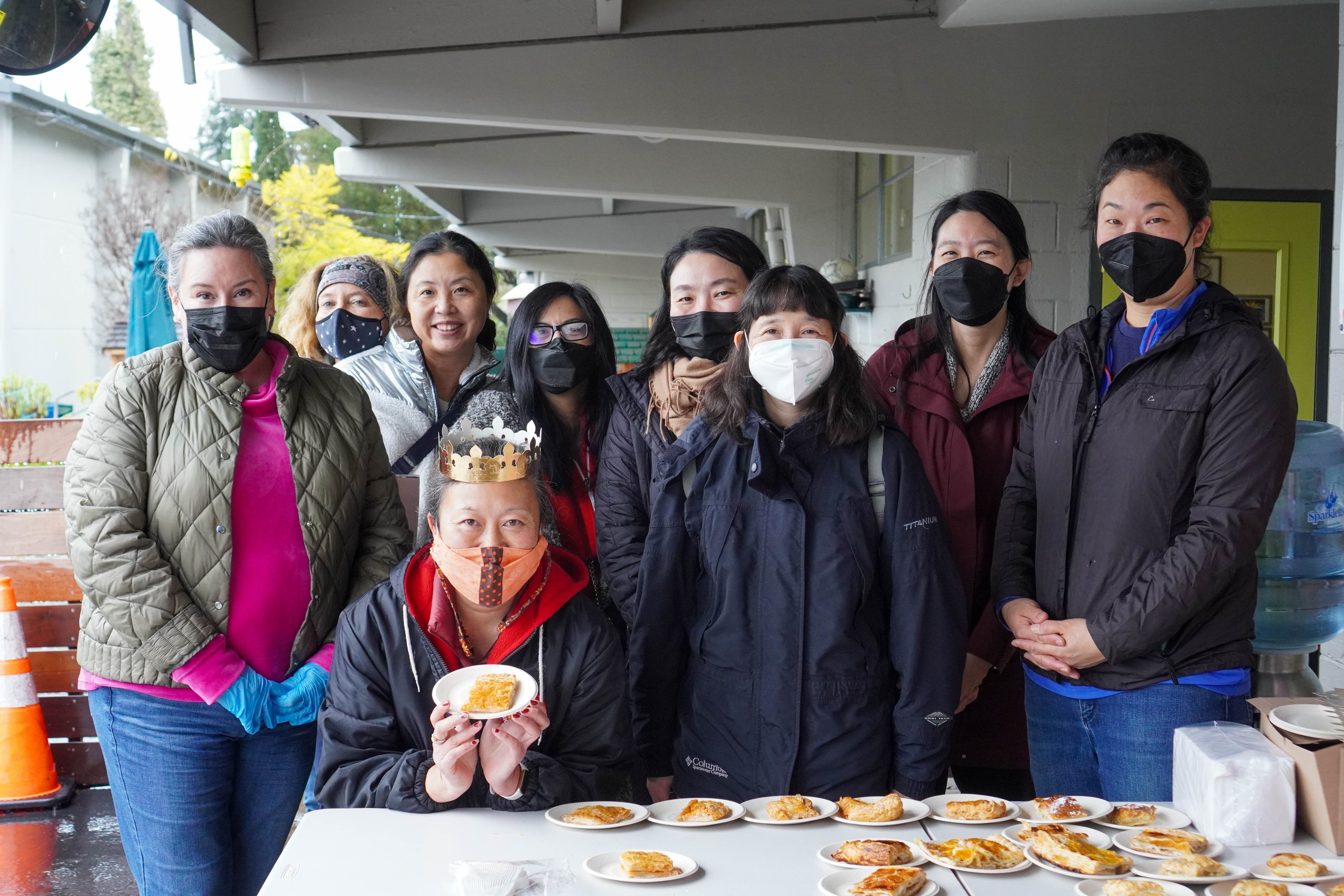 A group of parent volunteers getting ready to serve the galettes.