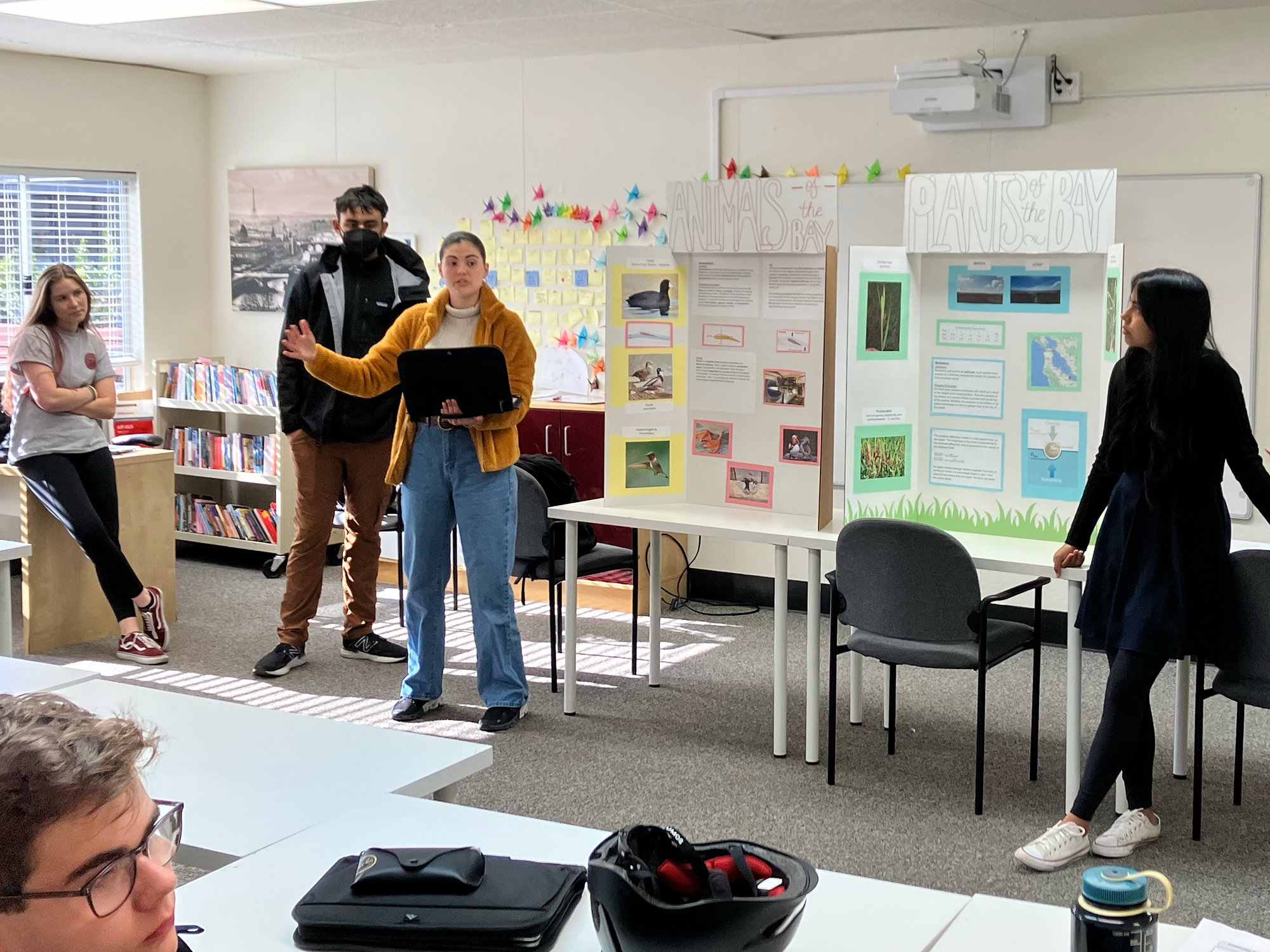 11th Grader students presenting their findings to a 9th Grade science class.