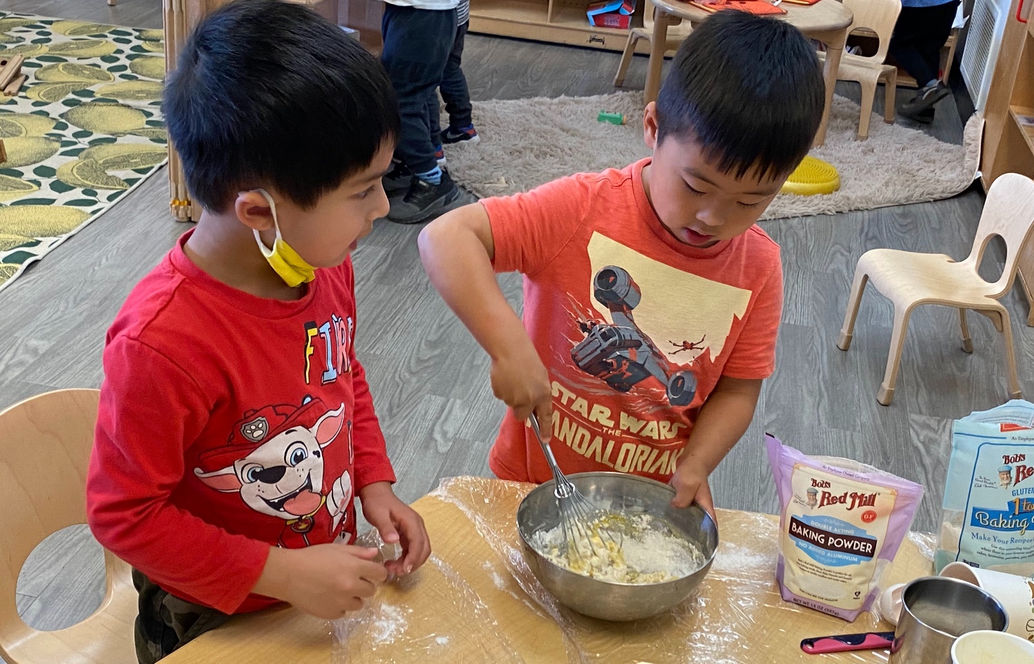 Chinese Program students mixing pancake batter in class.