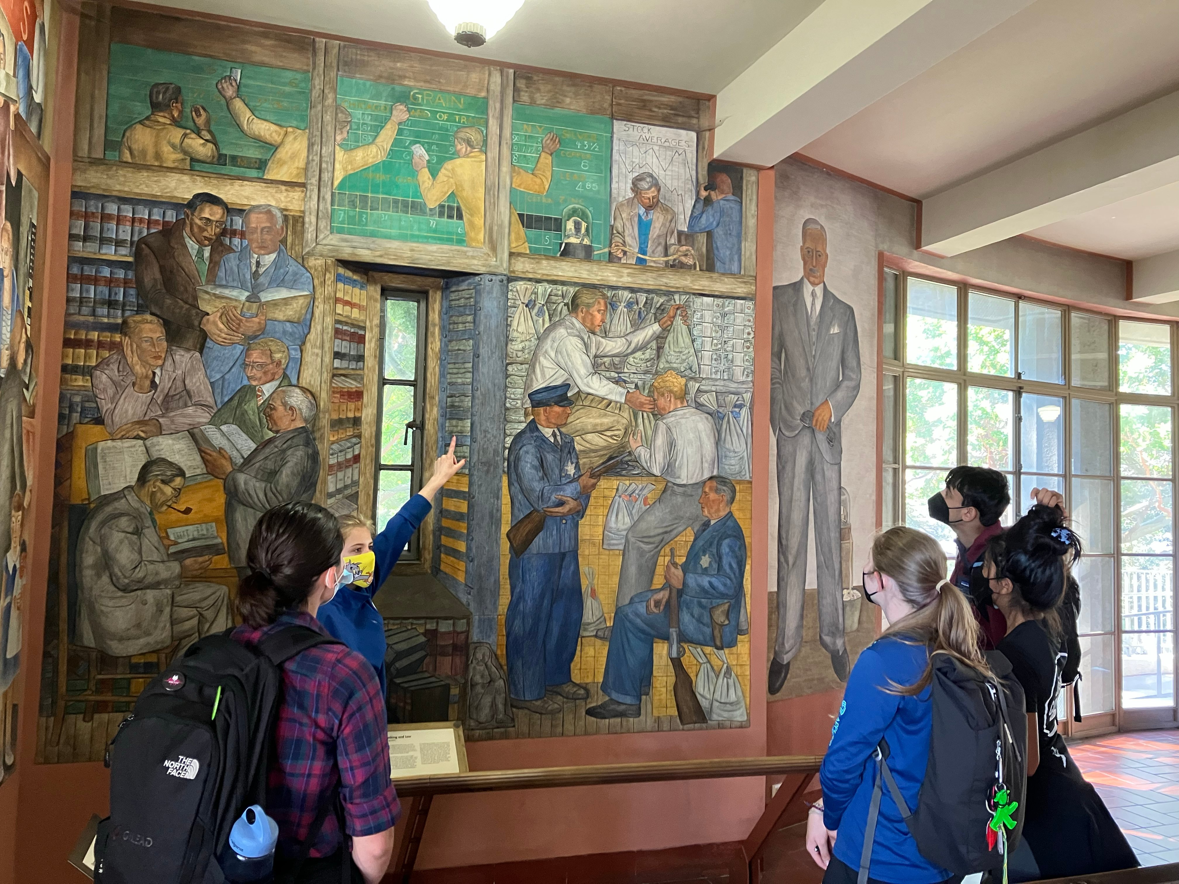 Diploma Programme students learning about the depression era murals at Coit Tower