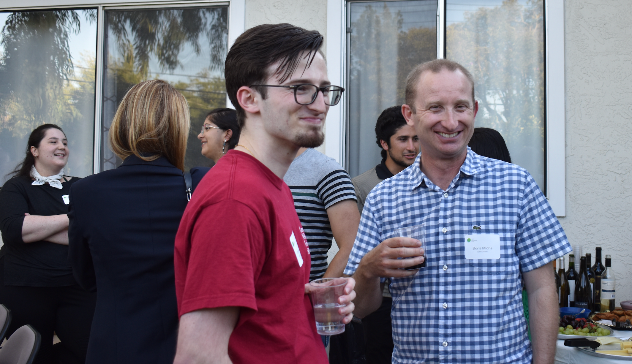 Arthur (left) and his father (right) at a recent alumni event at INTL.