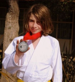 Nathan proudly displays his 2nd place win from the Palo Alto Judo Tournament.