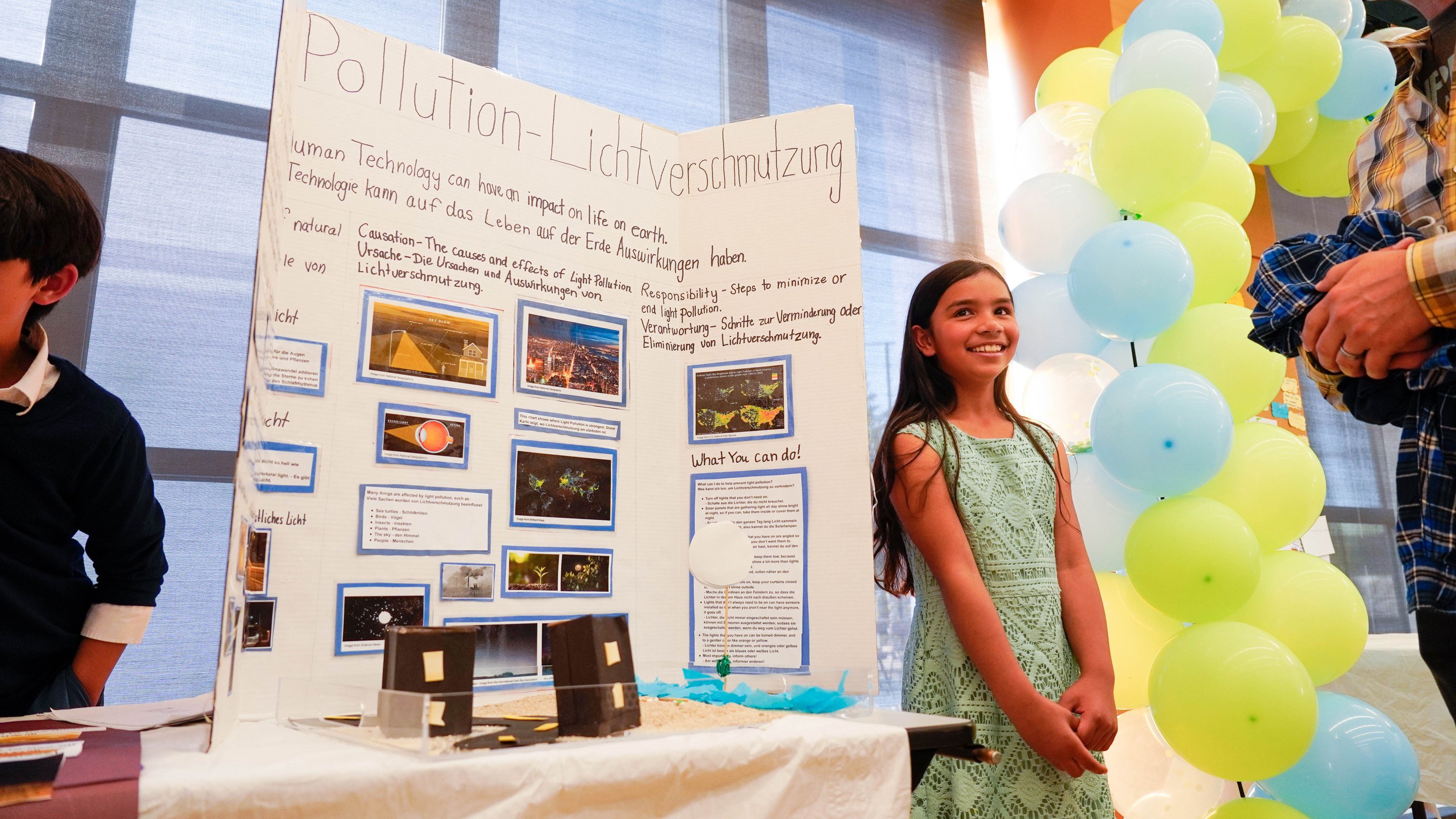 A 5th Grade german student presenting her PYP exhibition on pollution.
