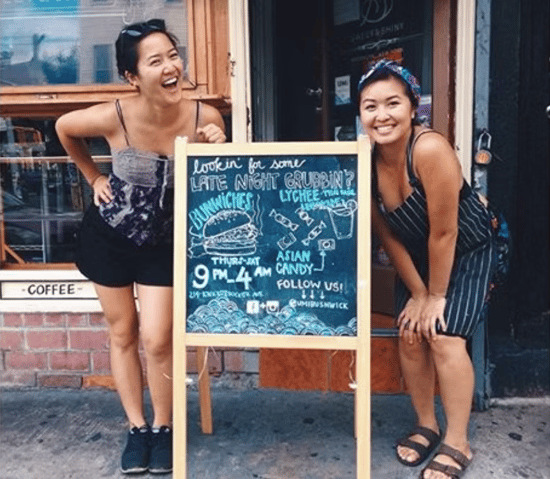 Renel posing in front of a coffee shop