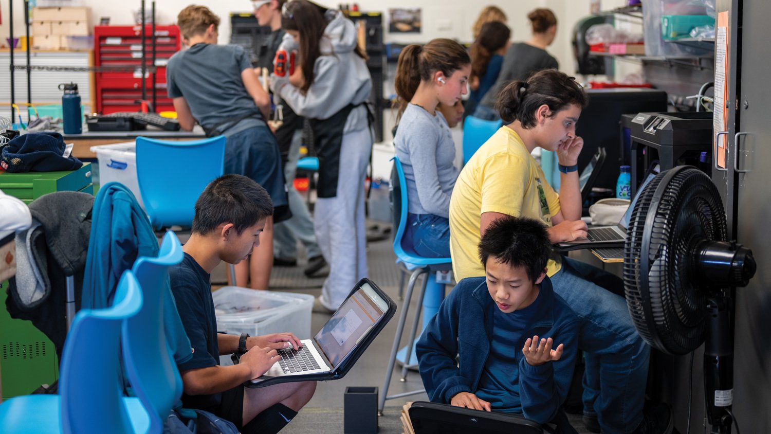 Upper School students solving problems with computers