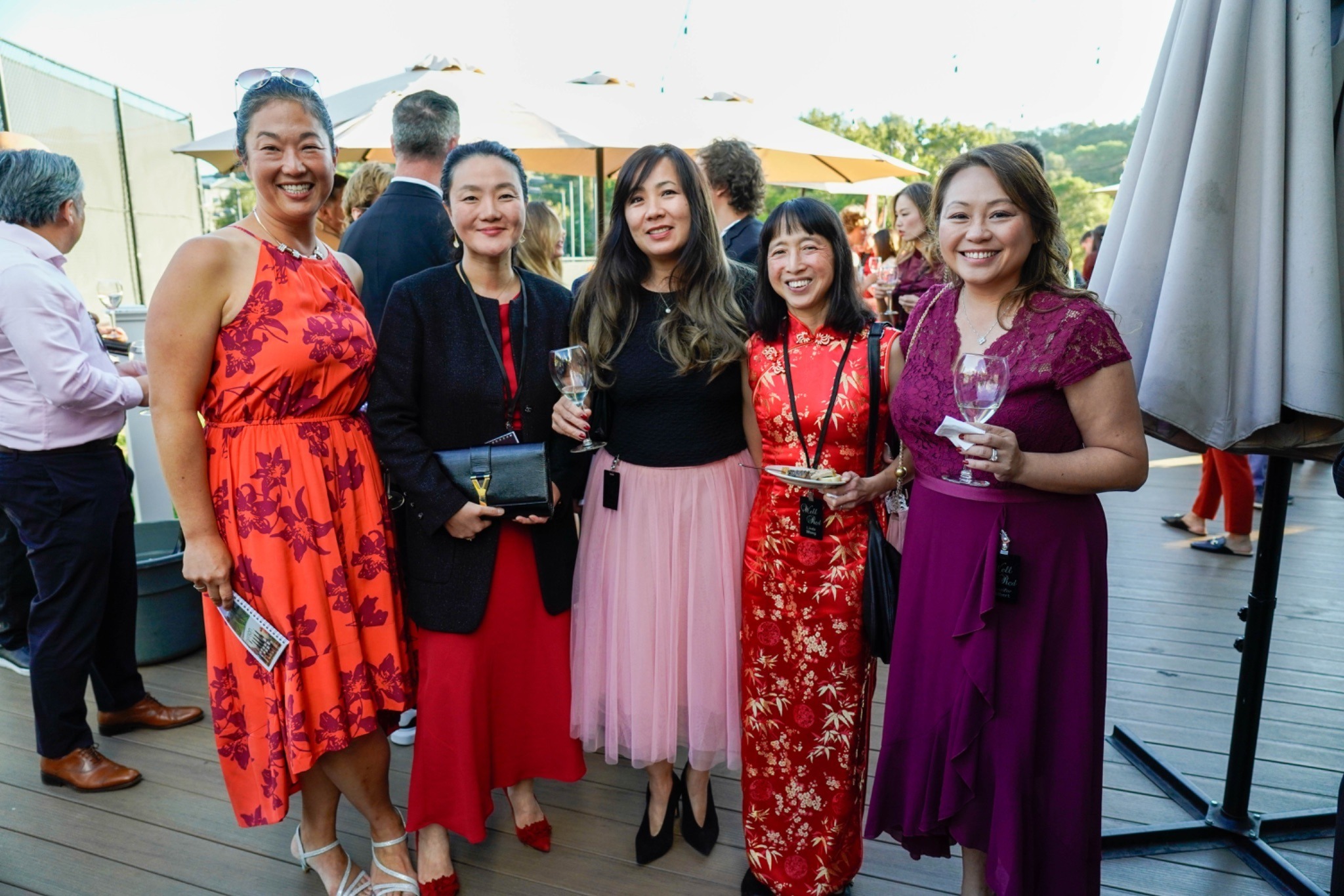 Five women pose together for the camera outside at SDV